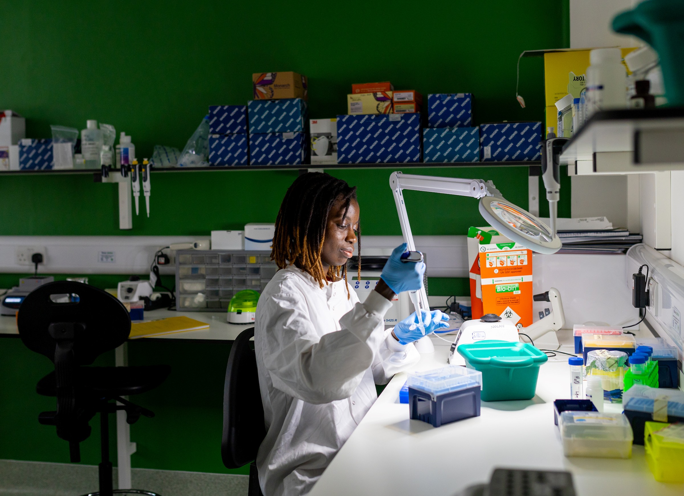 Photo of an LSTM student in the lab