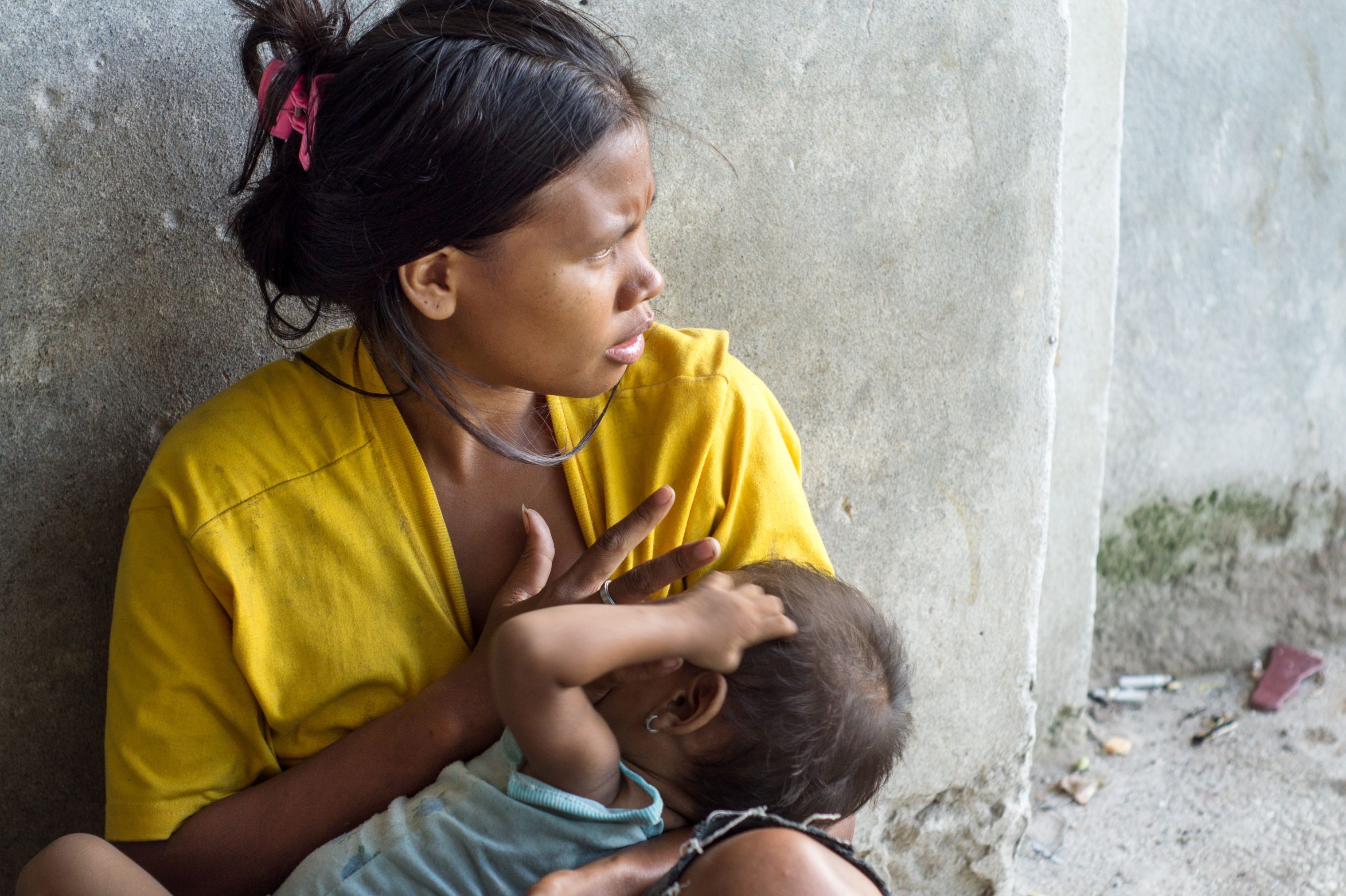 Photo of a woman holding a baby