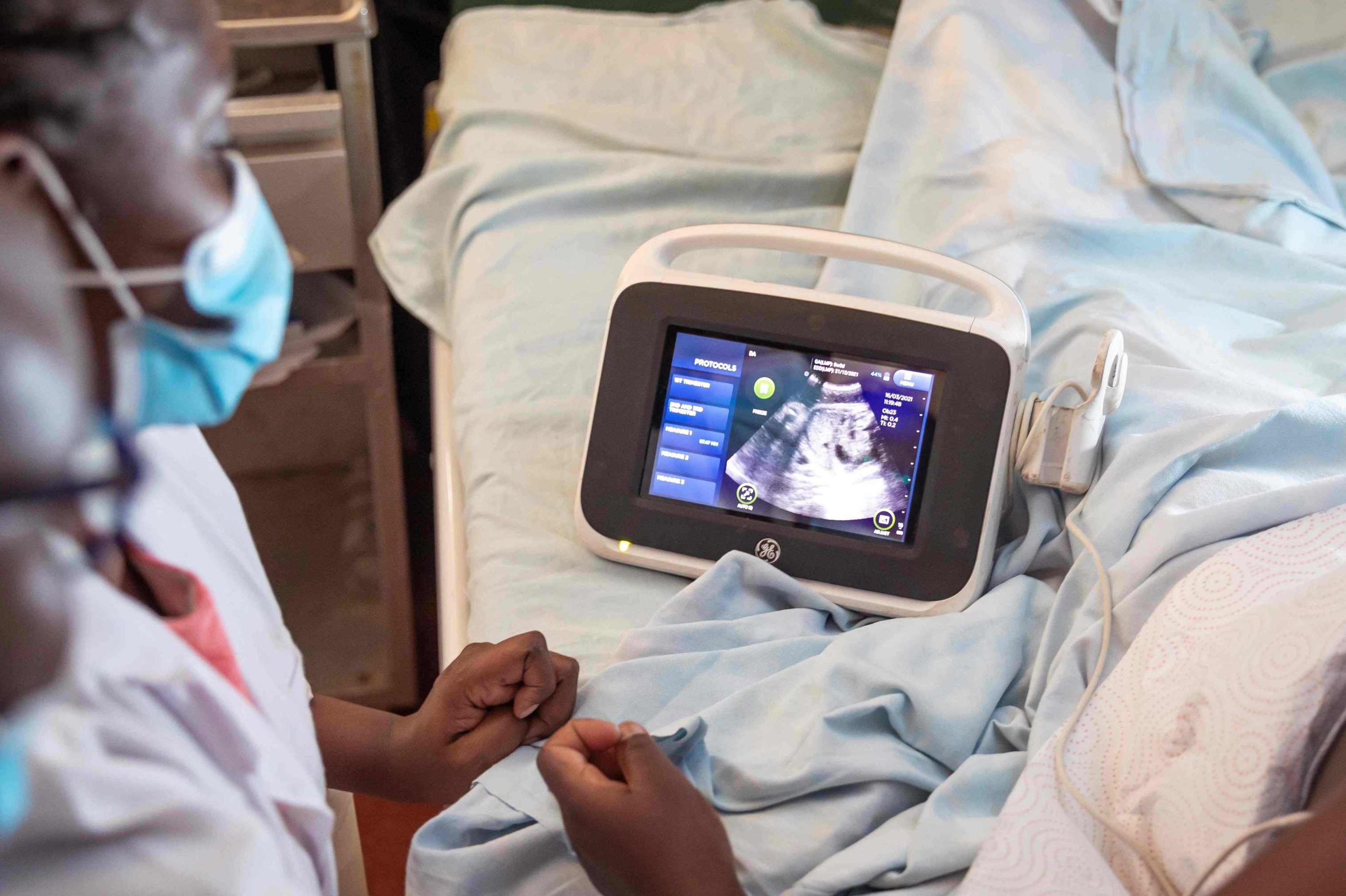 Photo of nurse midwives conducting an ultrasound scan