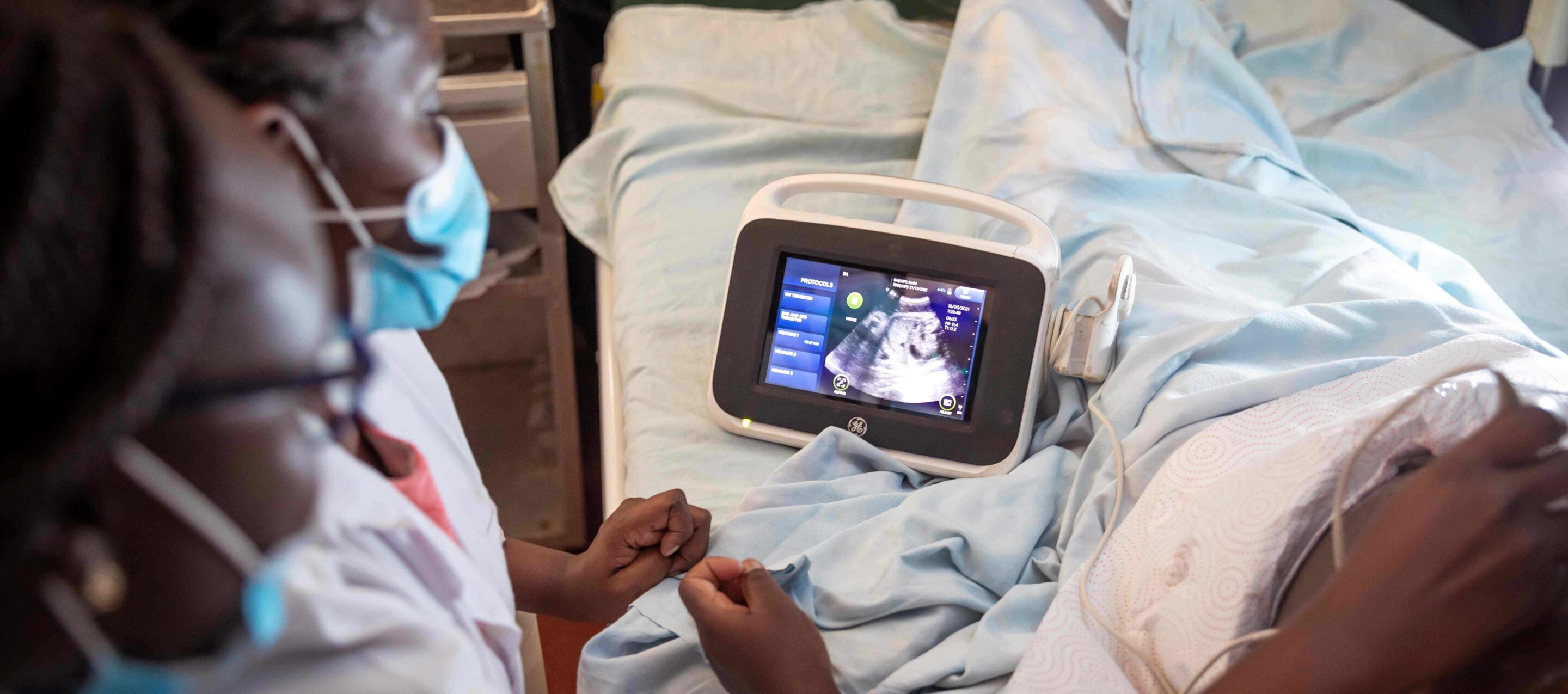 Photo of nurse midwives conducting an ultrasound scan