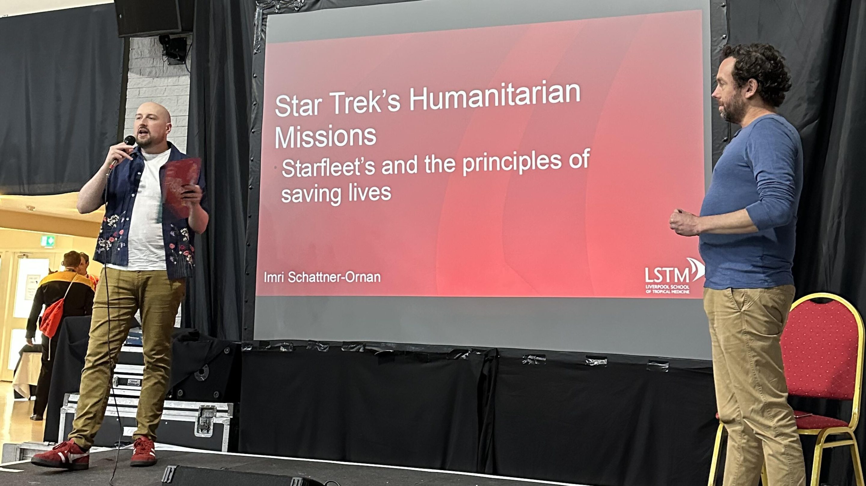 A photo of Professor Imri on stage at the star trek convention.
