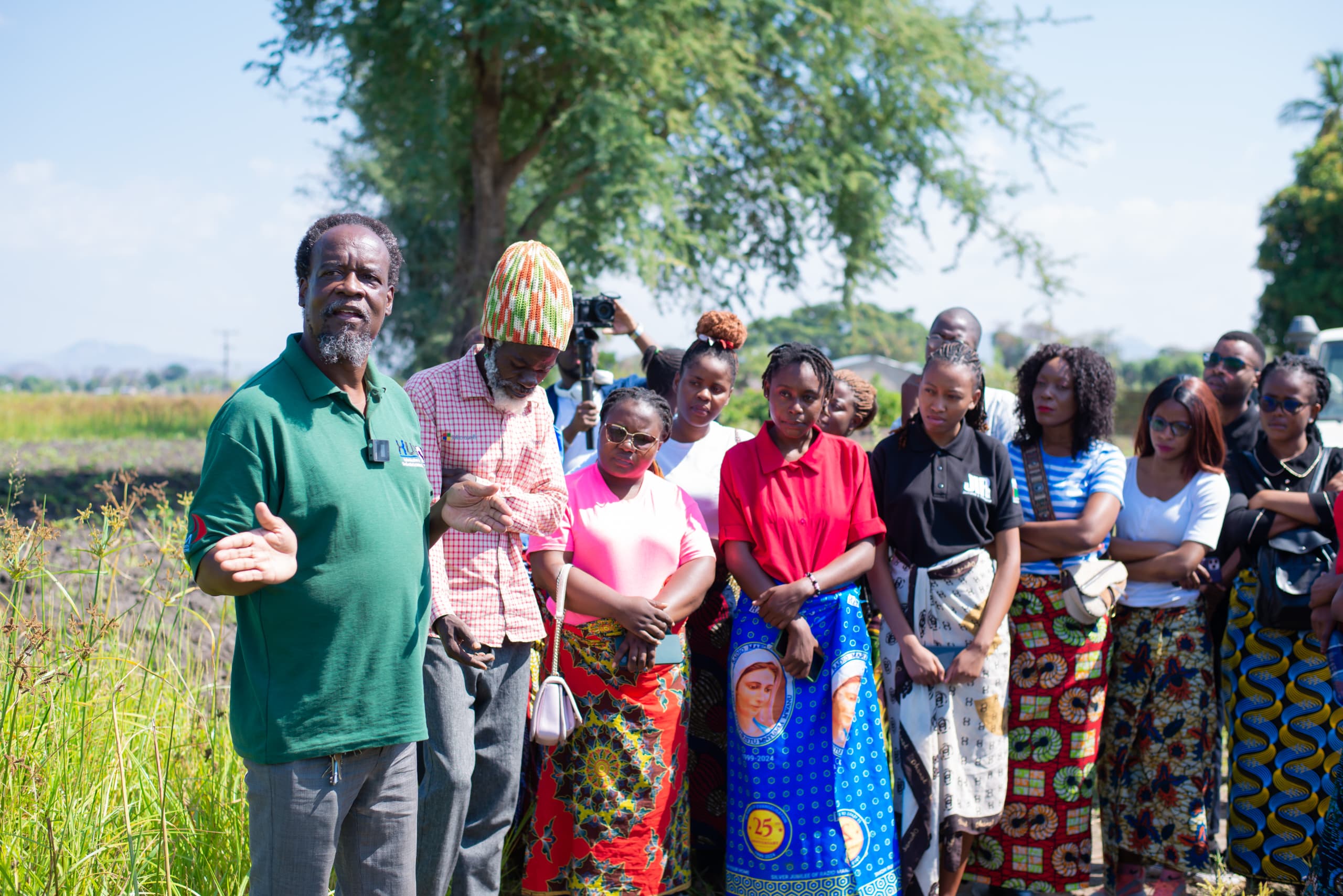 A photo of a large group of people in a village in Malawi.
