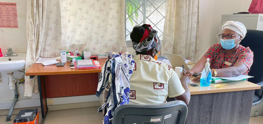 A photo of a doctor and a patient speaking to each other.