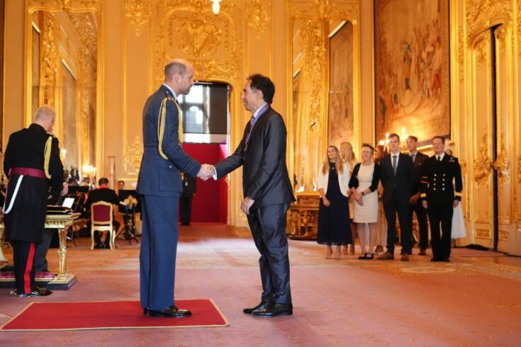 Photo of David Lalloo receiving the Companion of the Most Distinguished Order of Saint Michael and Saint George honour from the Prince of Wales (image: PA)