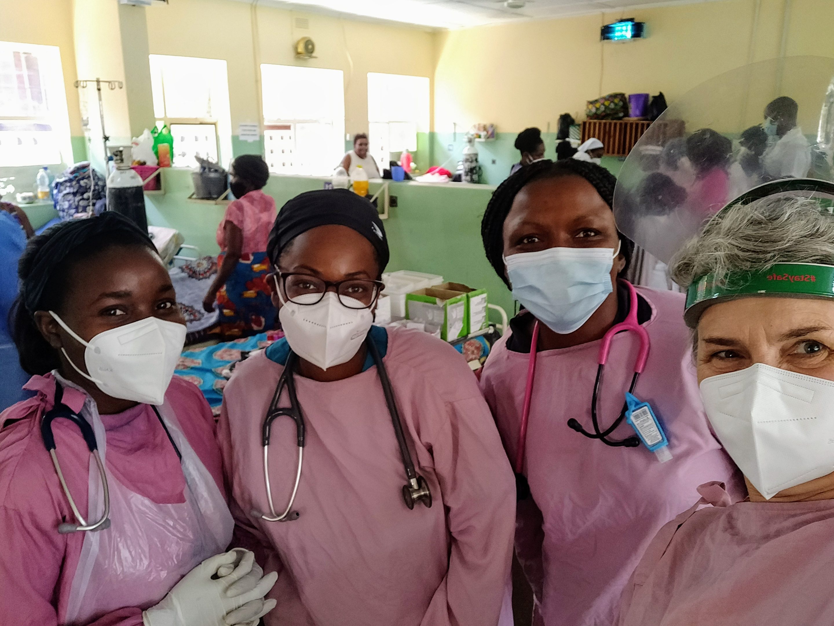 Photo of 3 tropical nursing students and their supervisor wearing facemasks.