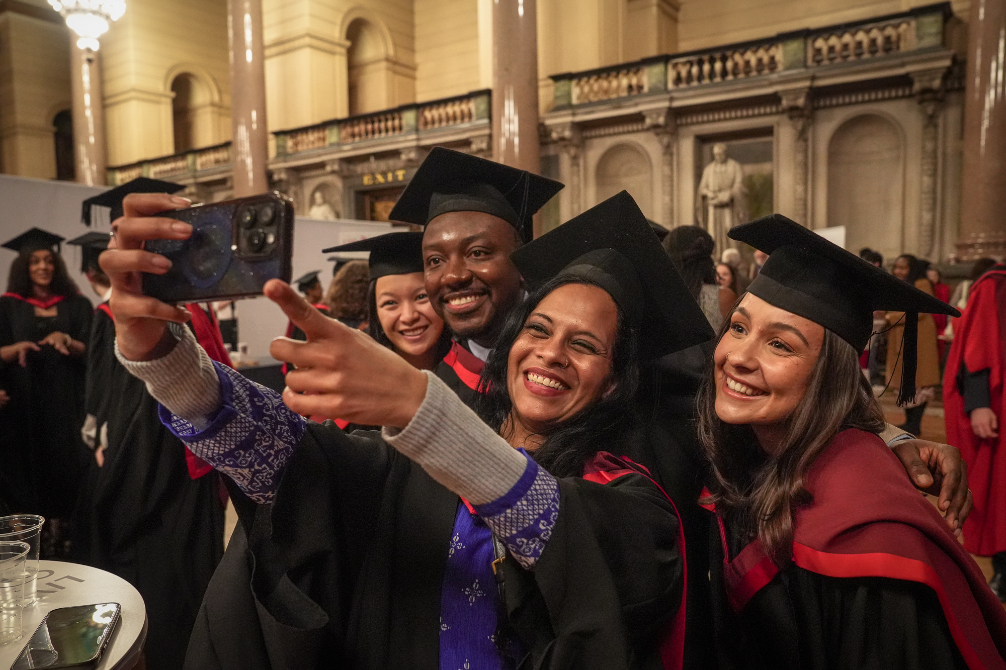 Photo of a group of graduands taking a selfie.